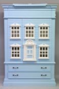 A CHILD'S BLUE HOUSE WARDROBE OF GEORGIAN DESIGN with two doors with shelves, two long drawers to