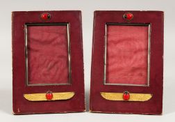 AN INTERESTING PAIR OF LEATHER PHOTOGRAPH FRAMES. 8.ins x 5.5ins