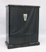 DAVID PATRICK GAGUECH (French Furniture Designer) A TWO-DOOR CABINET WITH A MACASSOR EBONY VENEER