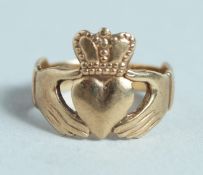 A 9CT GOLD CALDDAGH RING.