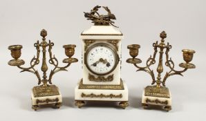 A 19TH CENTURY FRENCH WHITE MARBLE AND ORMOLU THREE PIECE CLOCK GARNITURE, the clock striking on a