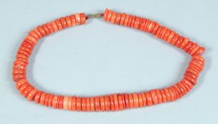A CORAL NECKLACE.