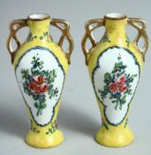 A MINIATURE PAIR OF YELLOW GROUND PORCELAIN TWO HANDLED VASES. 3.75ins high.