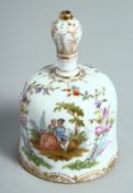 A CONTINENTAL PORCELAIN HAND BELL. 4ins high.