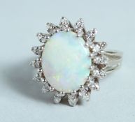 AN 18CT WHITE GOLD, OPAL AND DIAMOND CLUSTER RING.