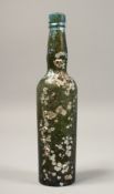 A SHIPWRECK IRIDESCENT BOTTLE. 10ins high.
