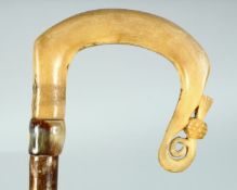 A SCOTTISH SPECIMEN CROOK, the bone handle carved with a thistle. 53ins long.