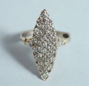A DIAMOND SET GOLD MARQUEE RING.