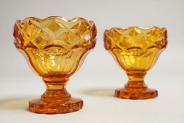 A PAIR OF AMBER GLASS SWEETMEAT DISHES.