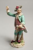 A 19TH CENTURY FURSTENBERG PORCELAIN FIGURE OF A MAN. Mark in blue, 5.5ins high.