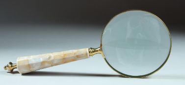 A MAGNIFYING GLASS with mother of pearl handle.