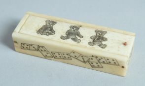 A BONE DICE BOX and dice the lid with three teddy bears. 2.75ins.