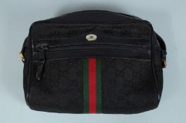A GUCCI LEATHER BAG 9ins long.