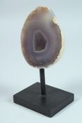 A SLICED GEODE on a stand. 4.5ins x3.75ins.