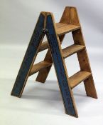 A PAIR OF CHAMPAGNE ADVERTISING FOLDING STEPS.