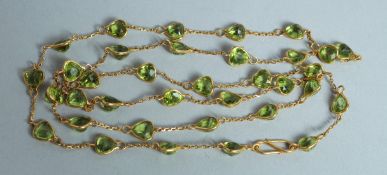 A GOOD 18CT GOLD PERIDOT NECKLACE.