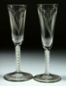 A PAIR OF GEORGIAN HOP GLASSES with long bowls engraved with hops, bowls 4.5ins long with white