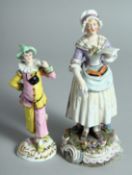A PORCELAIN FIGURE OF A JESTER, 6ins high and a figure of a LADY HOLDING A LETTER. 8ins high (2).