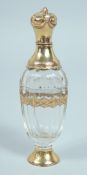 A GEORGIAN GOLD MOUNTED SCENT BOTTLE in a leather case. 10cm.