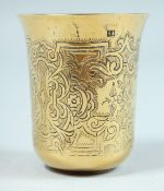 A RUSSIAN SILVER GILT BEAKER with engraved decoration. Mark:84, B. C. over 1869. 2.5ins high.