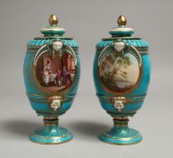 A VERY GOOD PAIR OF 19TH CENTURY SEVRES VASES AND COVERS, light blue ground with panels of figure