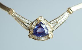 A SUPERB 14CT GOLD TANZANITE AND DIAMOND NECKLACE, purchased from Marshalls, Worksop