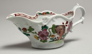 A CHAFFERS FINE SMALL CREAM BOAT painted in famille rose style with Chinoiserie landscapes to both