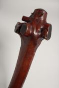 A POLYNESIAN CLUB with carved handle. 38ins long.