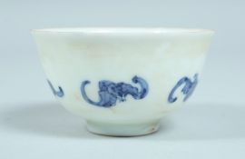 A CHINESE PORCELAIN TEA BOWL, the sides with bats.