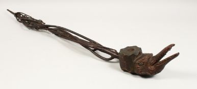 A FOLK ART CROCODILE PIPE. 36ins long.