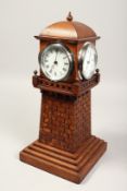 AN OAK FOUR SIDED LIGHTHOUSE CLOCK by Hn. MARC. 15ins high.