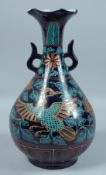 A CHINESE PETAL SHAPED BLUE GROUND VASE decorated with a phoenix and flowers. 15ins high.