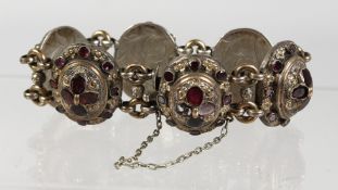 A GOOD ISLAMIC SILVER RUBY SET BRACELET.