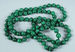 A STRING OF MALACHITE BEADS