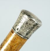 A VICTORIAN UMBRELLA with silver handle Birmingham 1896, 33ins long.