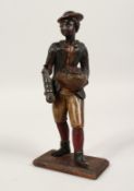 A 19TH CENTURY POLYCHROME WOODEN FLOWER SELLER. 9ins high.