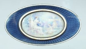 A RUSSIAN SILVER GILT AND ENAMEL OVAL BOX the lid with young ladies. Mark: 84, 2.25ins long.
