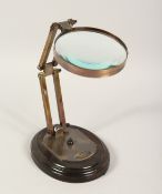 A MAGNIFYING GLASS on a stand.