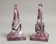 A PAIR OF SLAG GLASS OBELISKS. 8ins high.