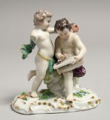 A SMALL MEISSEN GROUP OF TWO CHERUBS. Mark in blue (A/F) 4.5ins high.