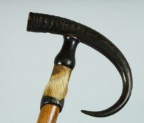 A SWISS WALKING STICK 'GRINDULWALD' with bone handle and hoof. 35ins long.