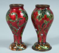 A SMALL PAIR OF FRENCH ENAMEL VASES 4.25ins.high.