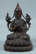 A CHINESE BRONZE BUDDHA on an oval base. 8ins high.