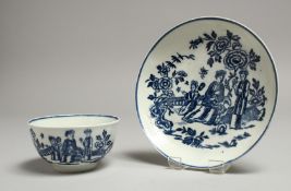 A CHRISTIANS LIVERPOOL TEA BOWL AND SAUCER printed with the Three Ladies pattern in blue under