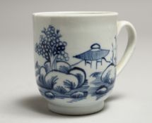 A CHAFFERS LIVERPOOL COFFEE CUP painted with a hut between rocks in under glaze blue