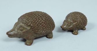 TWO JAPANESE BRONZE HEDGEHOGS.