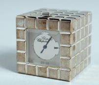 A CHOPARD ICE CUBE CLOCK, 1.25ins high. No. 51/8898/01 1076520 in original blue box.