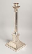A PLATED CORINTHIAN COLUMN LAMP on a square base. 17ins high.