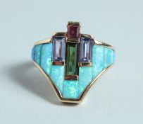 AN OPAL SAPPHIRE AND RUBY MODERN RING.