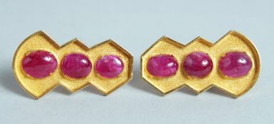 A GOOD PAIR OF CABOCHON RUBY EARRINGS in 18ct gold.